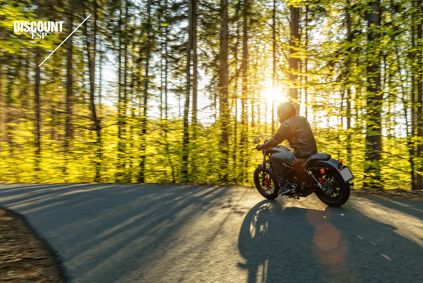 motorcycle riding on the road with the sun shining on a spring day