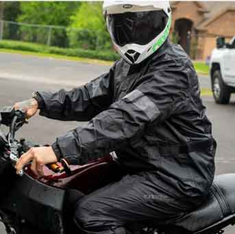 man on a motorcycle wearing alpinestars hurricane rain suit