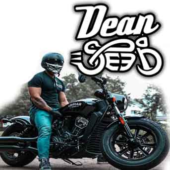 man sitting on an Indian Scout motorcycle with a dean speed logo