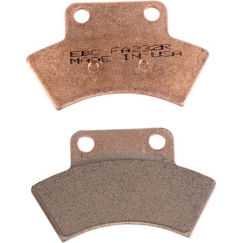 Two EBC sintered brake pads, one showing copper-colored metal backing with stamped text, the other showing dark friction.