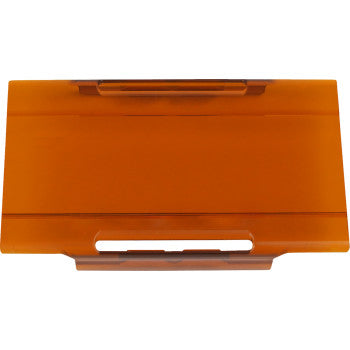A rectangular, translucent amber Light Cover E Series 4 by Rigid Industries made of polycarbonate plastic with a handle and slot, viewed from above on a white background.
