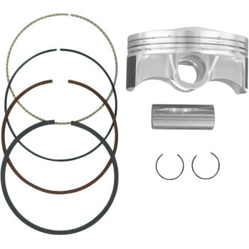 The Honda Piston Kit 94.00 mm by Wiseco includes a forged piston, four piston rings, a wrist pin, and two circlips, all arranged neatly on a white background.