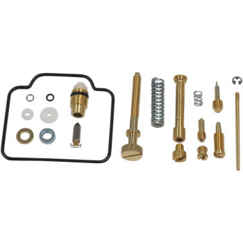 Carburetor repair kit with brass jets, springs, rubber gaskets, and metal washers arranged on white background.
