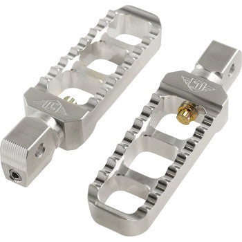 A pair of Serrated Footpegs - Silver- Narrow by Joker Machine, CNC-machined aluminum with a rectangular open-frame and serrated edges for grip, shown on a white background.
