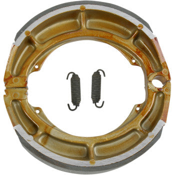 The Brake Shoes by Ebc feature a round metallic design with a gold finish, bonded brake linings, and include two original-style springs positioned side by side in the center.