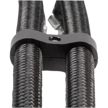 Close-up of two black 3/8 oil hoses secured by a black Jagg Oil Coolers Hose Separator with a small gray clamp and central screw.