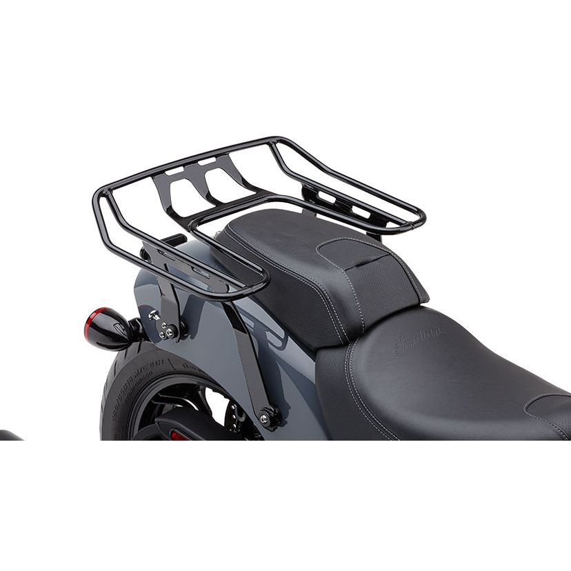 A close-up of the Cobra Detachable Big-Ass Wrap Around Luggage Rack in black, mounted above the rear seat of an Indian Chief 22-24 motorcycle with a sleek black leather seat and gray body.