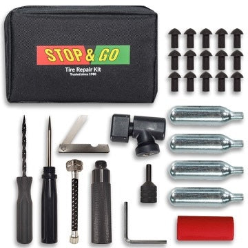 The Pocket Tire Plugger Kit Plus CO2 Inflation by Stop & Go includes a CO2 inflator, tools, mushroom plugs, accessories, and a storage pouch, all neatly organized on a white background.