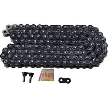 The 530 Max Z Drive Chain 120 Links Black & Chrome by RK is displayed with a master link, two connecting pins, and a lubricant packet arranged in front. Ideal for high-horsepower street bikes.