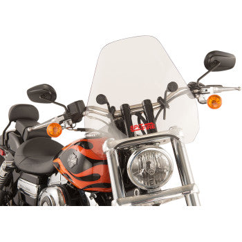 A motorcycle with orange flame detailing on the fuel tank, black handlebars with mirrors, two orange front turn signals, and a clear 15 Spitfire Windshield by Slipstreamer.