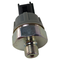 Metal and black plastic oil pressure switch with threaded hex base and electrical connector plug.