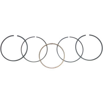 Five circular Yamaha Piston Rings 47.00 mm by Wsm—four gray and one gold with a textured pattern—are arranged in sequence on a white background, showcasing their use in cylinder applications.