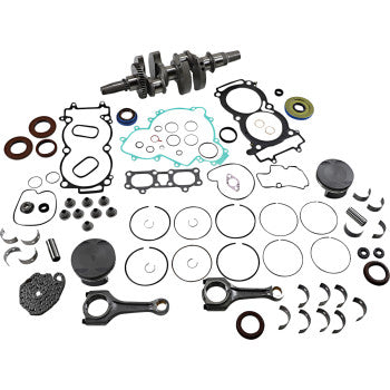 Complete Polaris engine rebuild kit with crankshaft, piston rings, gaskets, seals, and connecting rods, laid out on white.