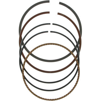 Set of dark metal piston rings with varying thicknesses and textured surfaces arranged in a stacked circular formation.