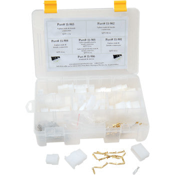 Clear plastic organizer box with multiple compartments holding white wire connector terminals and small gold metal.