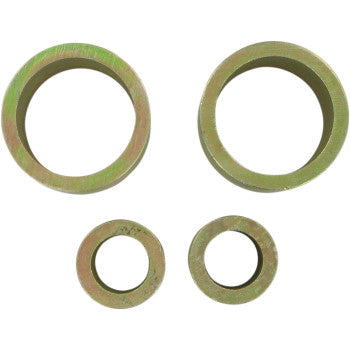 Four metallic washers of varying sizes, arranged in two rows on a white background—perfect for use with the High Lifter Lift Kit Front 2.00 to enhance durability and provide increased clearance for your ATV or big wheel kit.