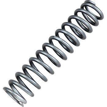 A close-up of the Shock Spring Rear Silver by High Lifter, a tightly wound, shiny metal coil shown diagonally on a white background, designed to reduce fatigue while maintaining optimal weight capacity.