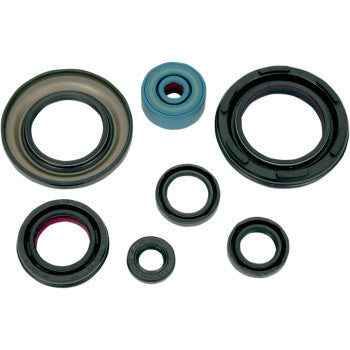 The Oil Seal Kit Yamaha YFZ 350 by K&S Technologies includes seven assorted circular oil seals—mostly black, one blue, some with contrasting inner rings—displayed on a white background, ideal as reliable OEM replacements.