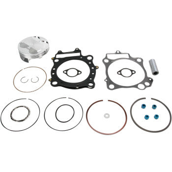The Honda Piston Kit with Gaskets 96.00 mm by Wiseco includes a metal cylinder, gaskets, rings, blue bolts, and circlips—all displayed on a white background.
