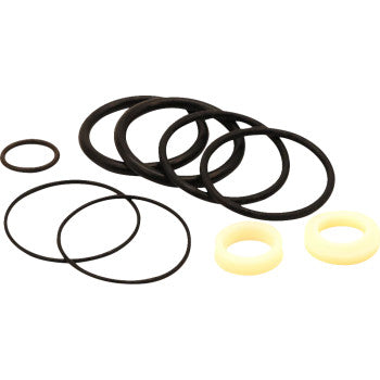 The Shock Service Kit by Hygear Suspension includes assorted black rubber O-rings and two cream plastic rings on a white background, perfect for shock maintenance or as an OEM replacement.