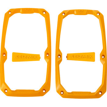 The Trim Kit Embark Side View Yellow by Seizmik includes two yellow, rectangular plastic frames with screw holes and two small SEIZMIK-labeled pieces—ideal for customizing Seizmik Side View Mirrors. All parts are shown on a white background.