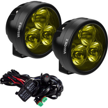 The Vision X Light Cannon Driving Beam with Selective Yellow Lens, featuring round black housings and high-output LEDs, is shown alongside wiring and connectors—perfect for automotive or off-road lighting setups.