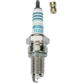 The Denso Iridium Spark Plug IX22B features a white ceramic insulator, metal threads, and a separate terminal nut above it, all designed for high temperature resistance, shown on a white background.