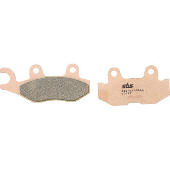 Copper-colored sintered brake pads with textured friction surfaces and mounting tabs, branded SBS.