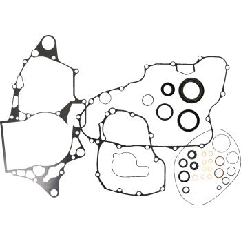 The Honda Bottom End Gasket Kit by Cometic is displayed on a white background, showcasing various gaskets and oil seals in multiple shapes—perfect for engine rebuilds.