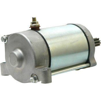 The Starter Motor by Parts Unlimited features a metallic cylindrical body, two mounting brackets, top electrical terminals, and an end gear—engineered to OEM specs for dependable performance.
