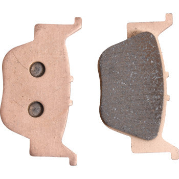 The image shows two Sintered Brake Pads by All Balls: the left pad displays its flat back with two circular indents, while the right reveals its textured friction surface for enhanced stopping power.