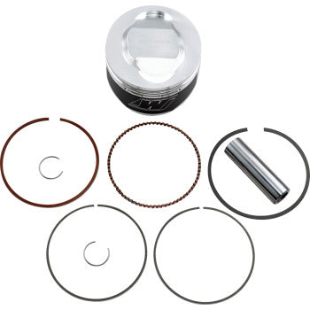 The Yamaha Piston Kit 83.50 mm by Wiseco includes a high-performance piston, a cylindrical pin, and five circular rings, all displayed on a white background to highlight their impressive strength-to-weight ratio.