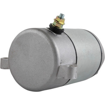 The Starter Motor by Parts Unlimited features a cylindrical metal solenoid with a rounded end cap, copper bushings, side mounting brackets, and a threaded bolt with nut and washer for electrical connection—engineered to OEM specs.