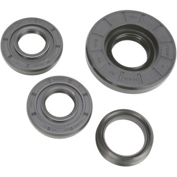 Four black TC rubber seals of varying sizes are shown on a light background. Each features markings and grooves, perfect for use in the Honda Differential Seal Kit Front by Moose Offroad or with EMQ quality bearings.