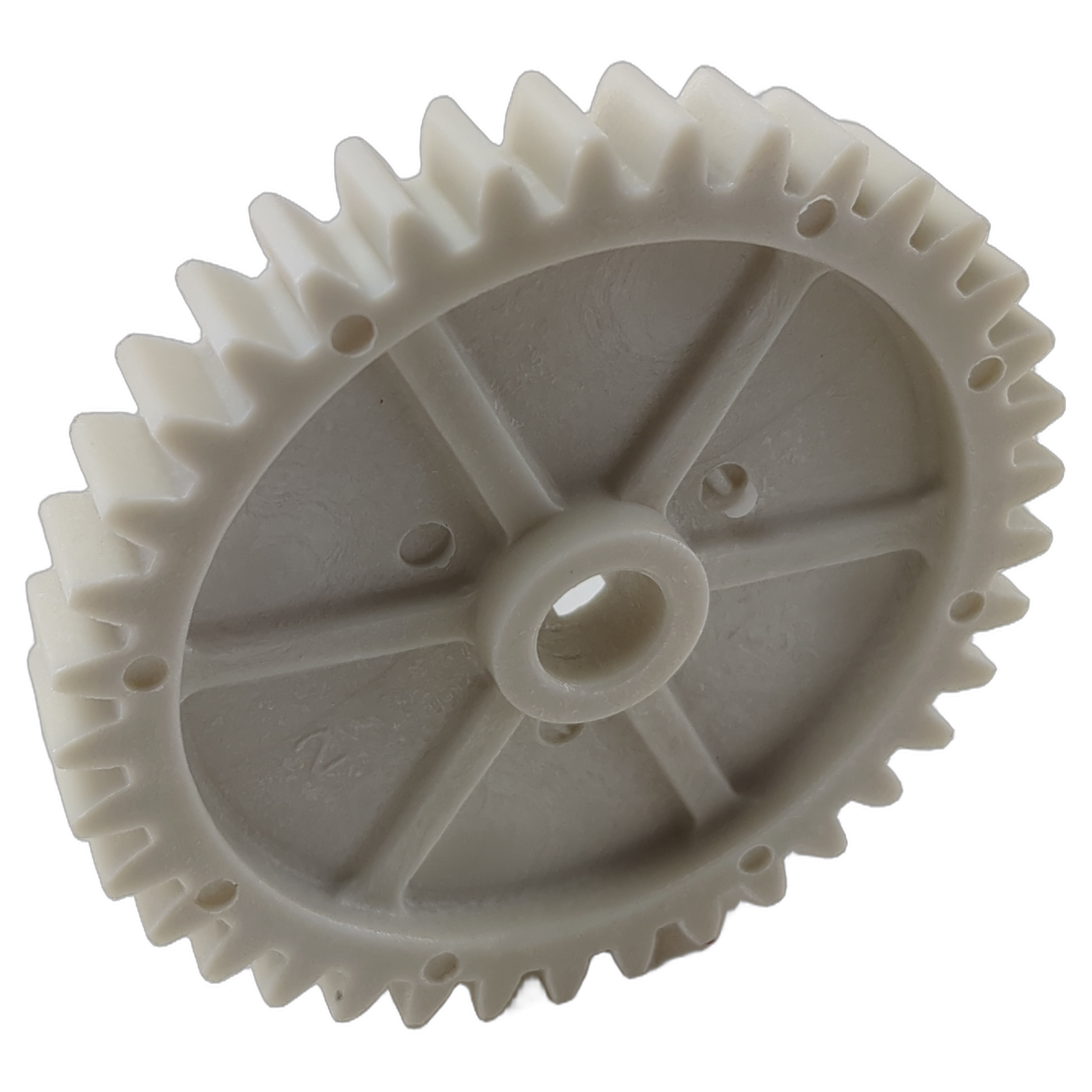 Gray plastic oil pump drive gear with evenly spaced teeth and central mounting hole.