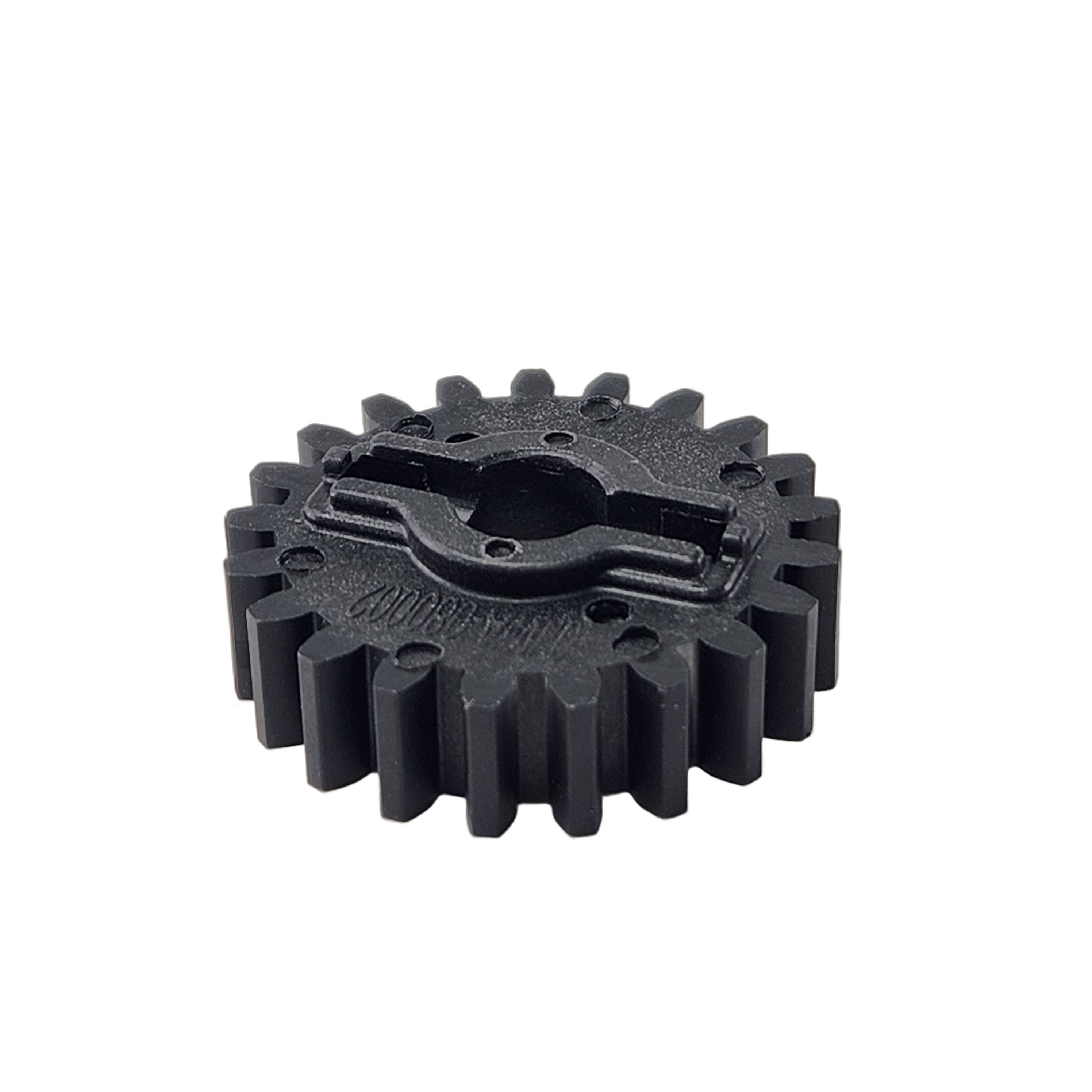 A black plastic Gear Waterpump by CF Moto with evenly spaced teeth and a central hole, OEM part 0JWA-080002 for CF-Moto UTVs, shown against a white background.