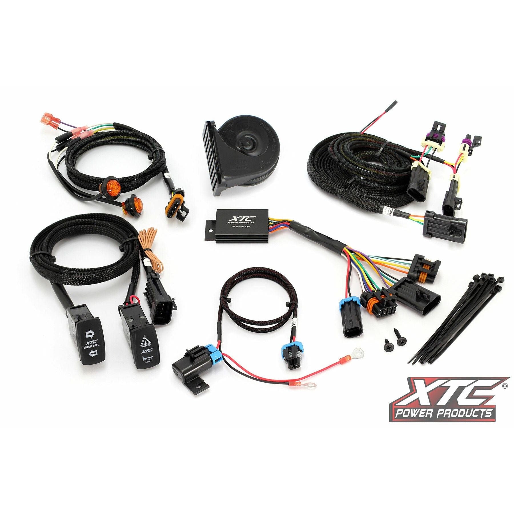 The Self Canceling Turn Signal Kit Hon by XTC Power is shown arranged on a white background with wiring harnesses, switches, connectors, zip ties, a small horn, and the Plug and Play control module. The XTC Power Products logo appears in the bottom right corner.