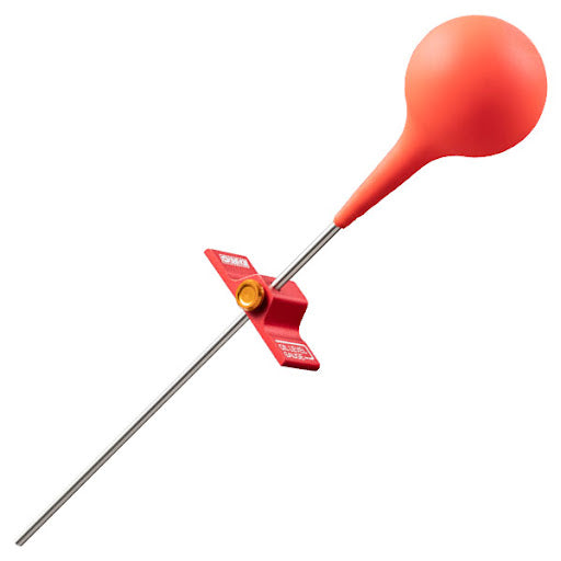 Silver metal rod with red aluminum clamp and orange flexible rubber bulb-shaped top fork oil level gauge.