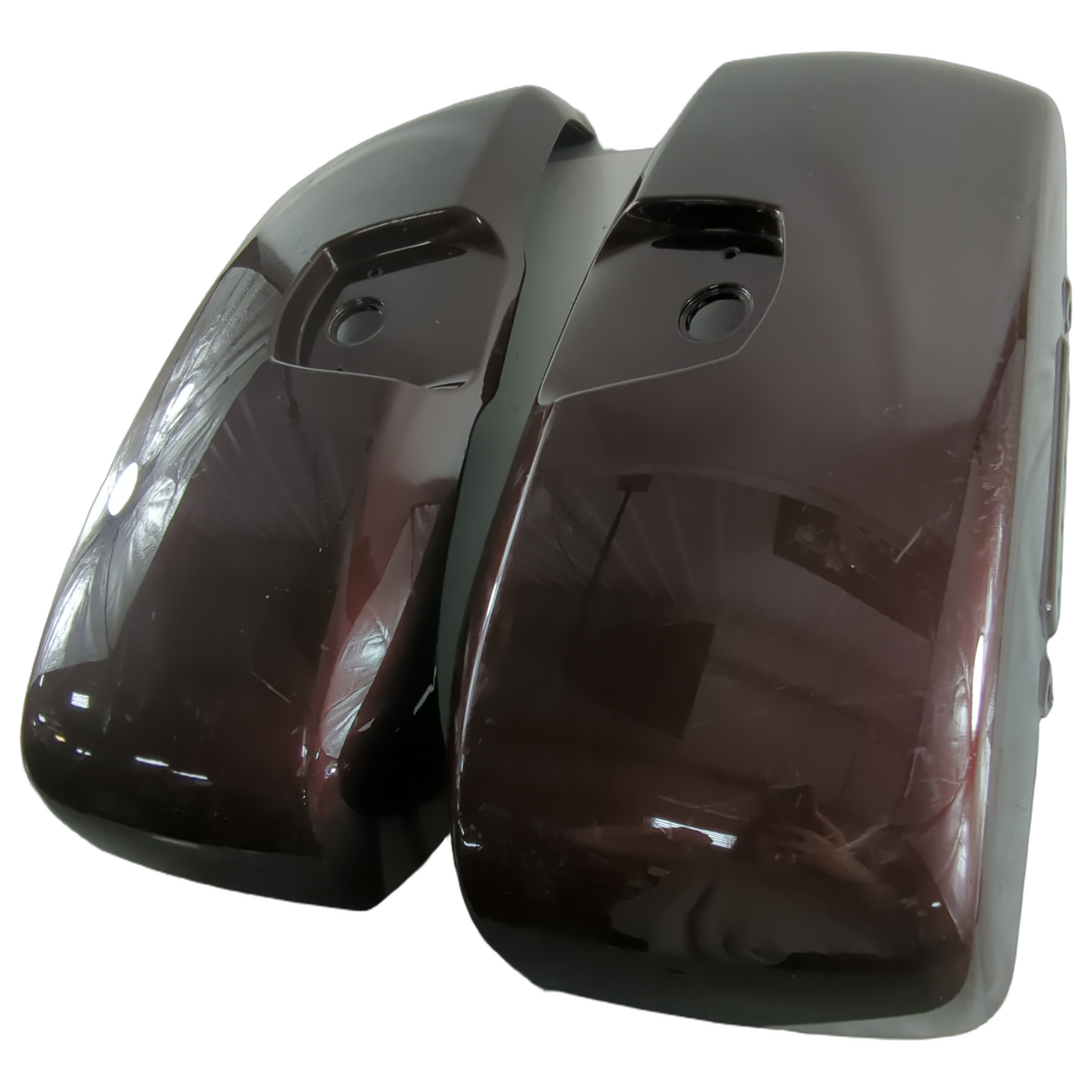 Glossy burgundy motorcycle saddlebag lids with smooth curved edges and mounting holes.