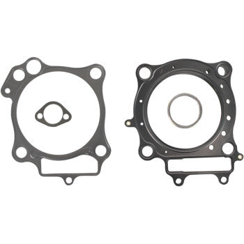 The Honda Standard Bore Cylinder Gasket Kit by Vertex includes two metal gaskets with circular and oval cutouts, perfect for cylinder rebuilds. One has three main holes; the other features a large central ring and extra hole patterns.