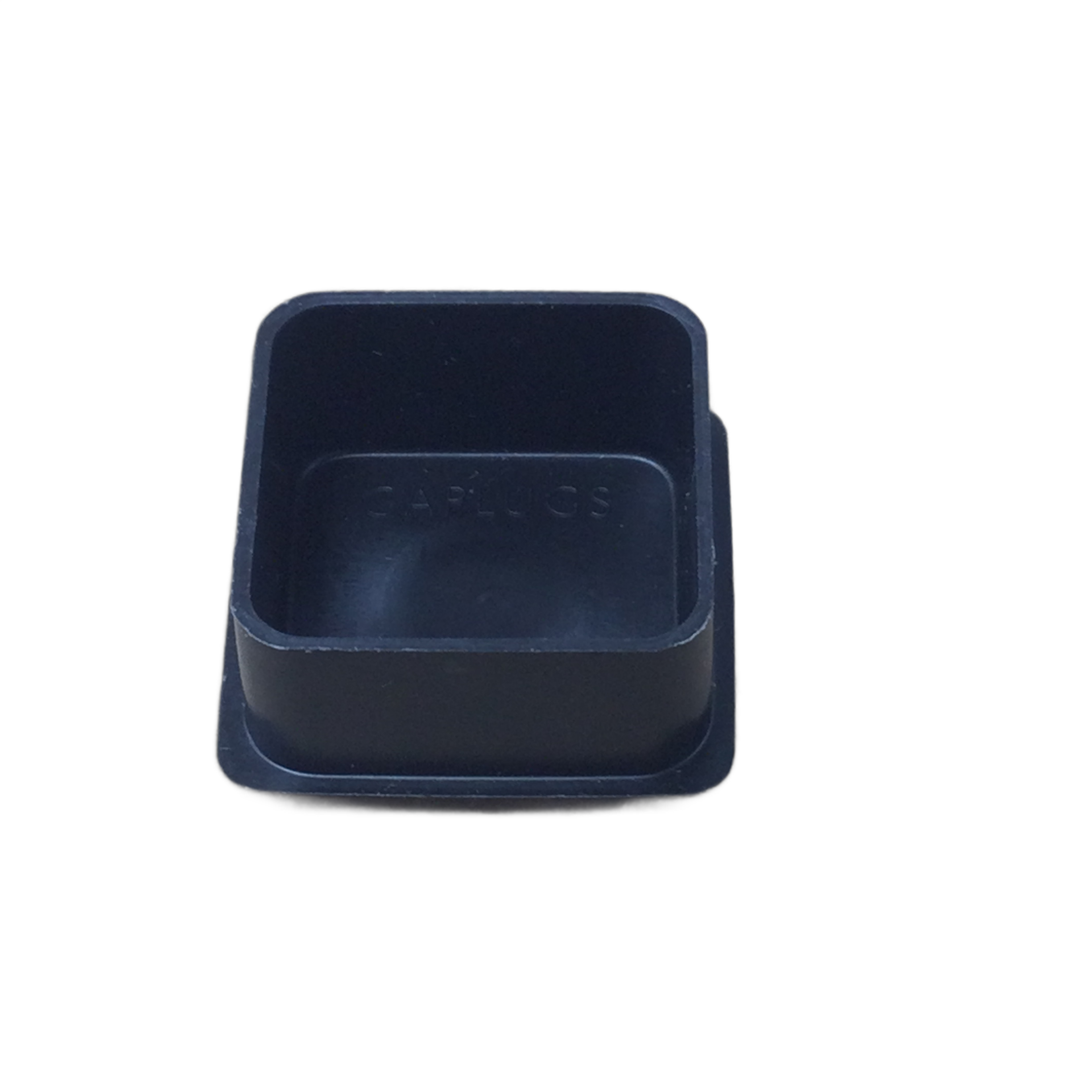Small square black plastic cap with slightly raised edges and a smooth surface.