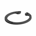 Black circular retaining ring with open ends and flat profile made of metal.