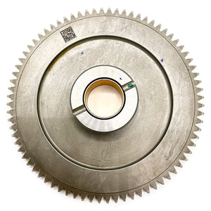 Silver metal crank starter gear with fine teeth around edge and circular central hub.