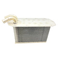 Silver metal turbo intercooler core with stacked cooling fins and dual curved inlet pipes.