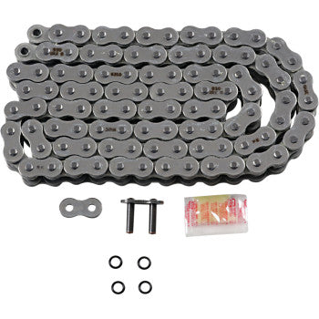 The 530 Max O Drive Chain 112 Links by RK, made in Japan, is displayed with a master link, two link pins, four rubber O-rings, and a packet of lubricant laid out in front.