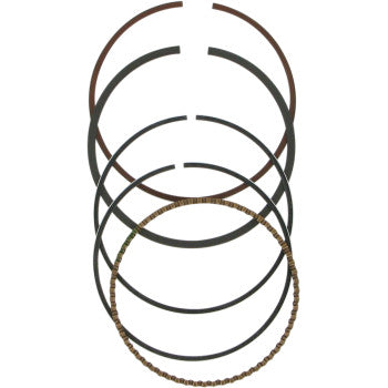 Five piston rings from the Ring Set by Wiseco are arranged vertically on a plain white background—four are solid black, and one lower ring has a textured metallic brown finish.
