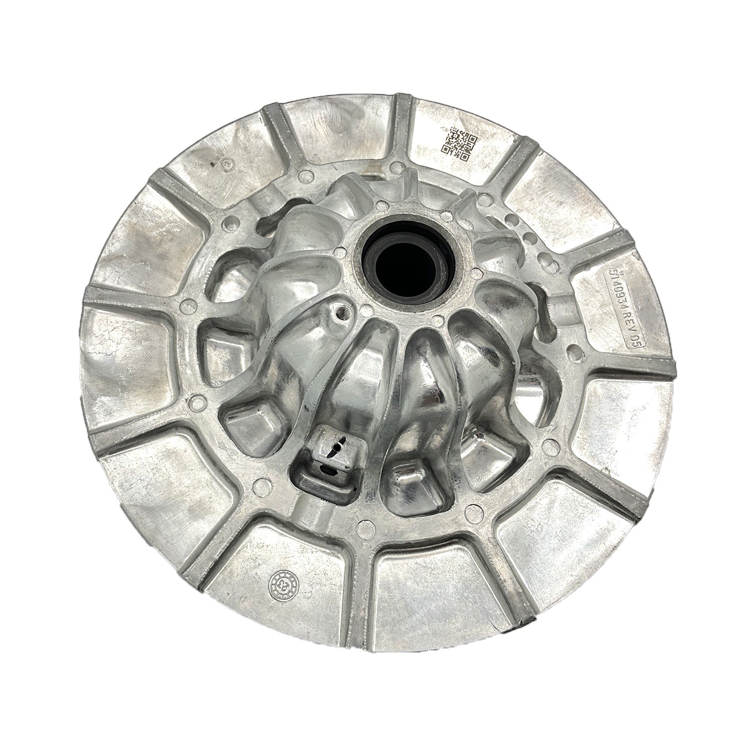 Silver metallic circular P90X Driven Stationary part with central hole and multiple raised segments.