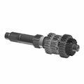 Black metal input shaft with multiple gear sets and splined ends for motorcycle transmission.