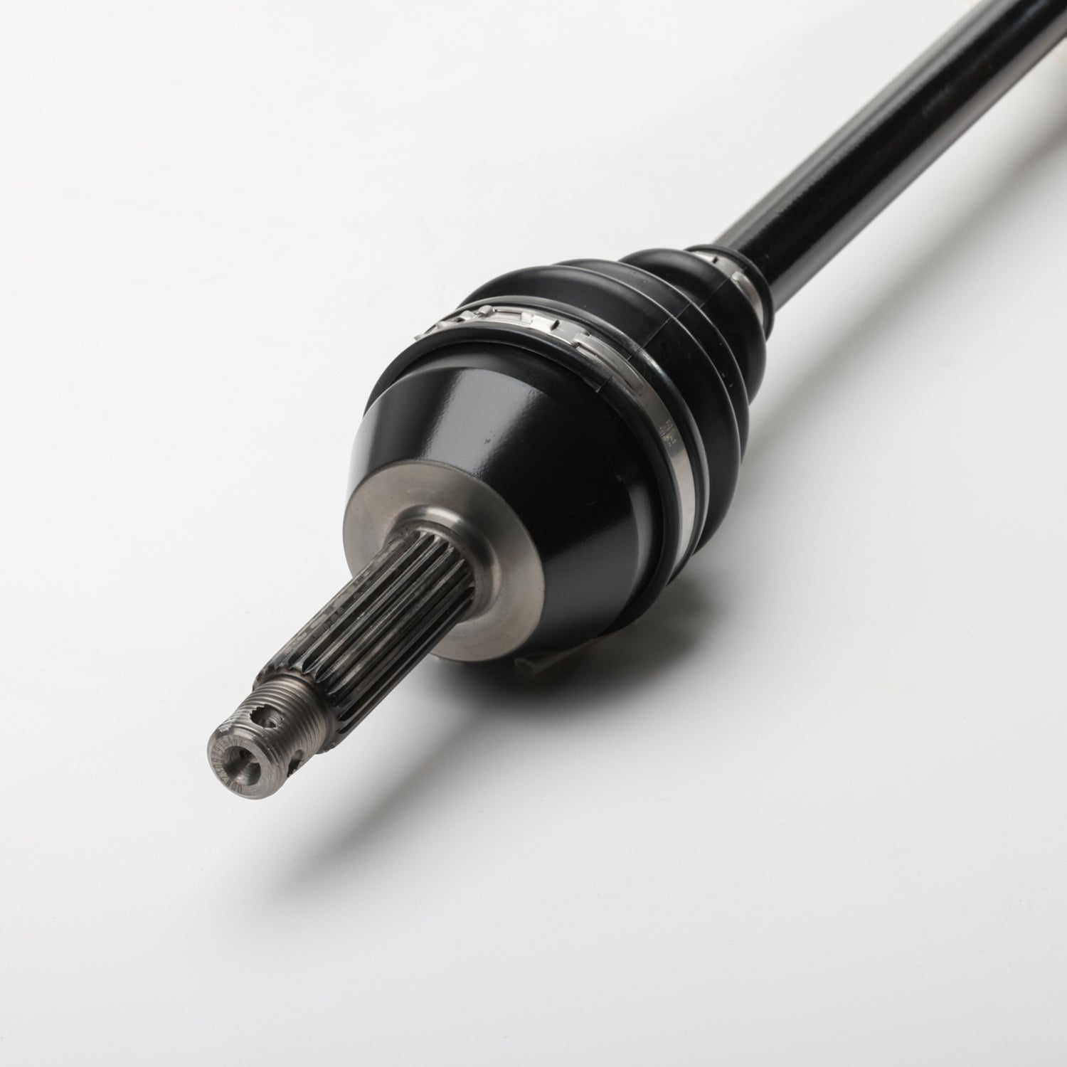 Black metal front CV shaft with splined end and accordion-style rubber boot covering joint.