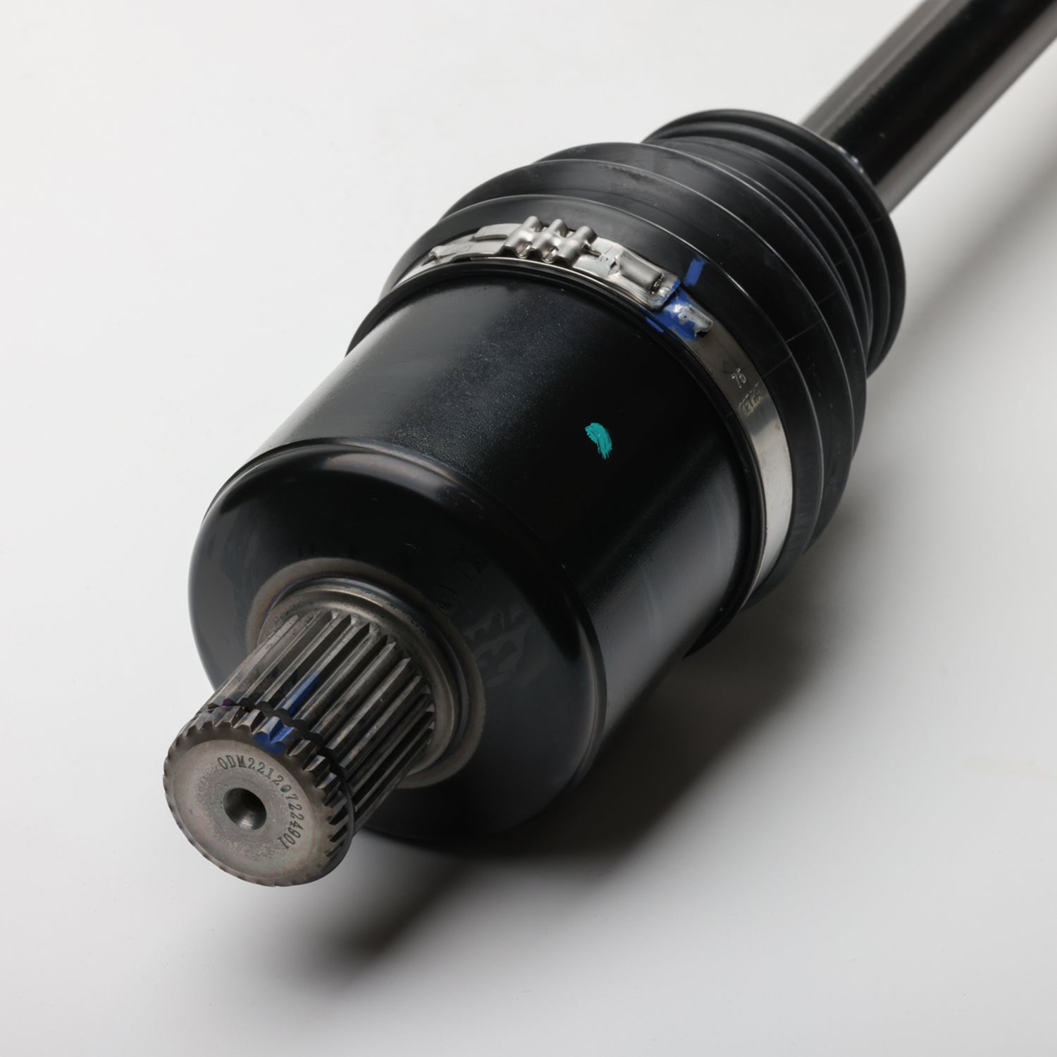 Black metal front CV shaft with ribbed rubber boot and silver clamp, splined gear end.